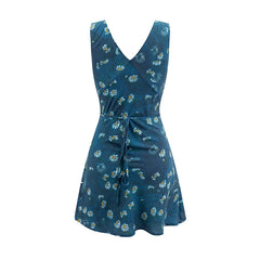 Back view of a sleeveless V-neck A-line mini dress with a blue background and white daisy print, featuring a tie detail.