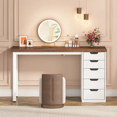 Modern vanity setup with mirror, stool, and drawers in a room.
