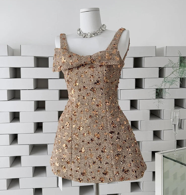 Sequin mini dress with bow detail on a mannequin
