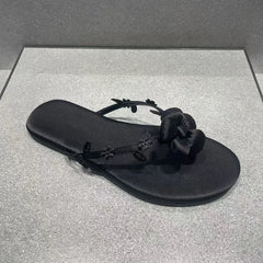 Black floral embellished flip-flops