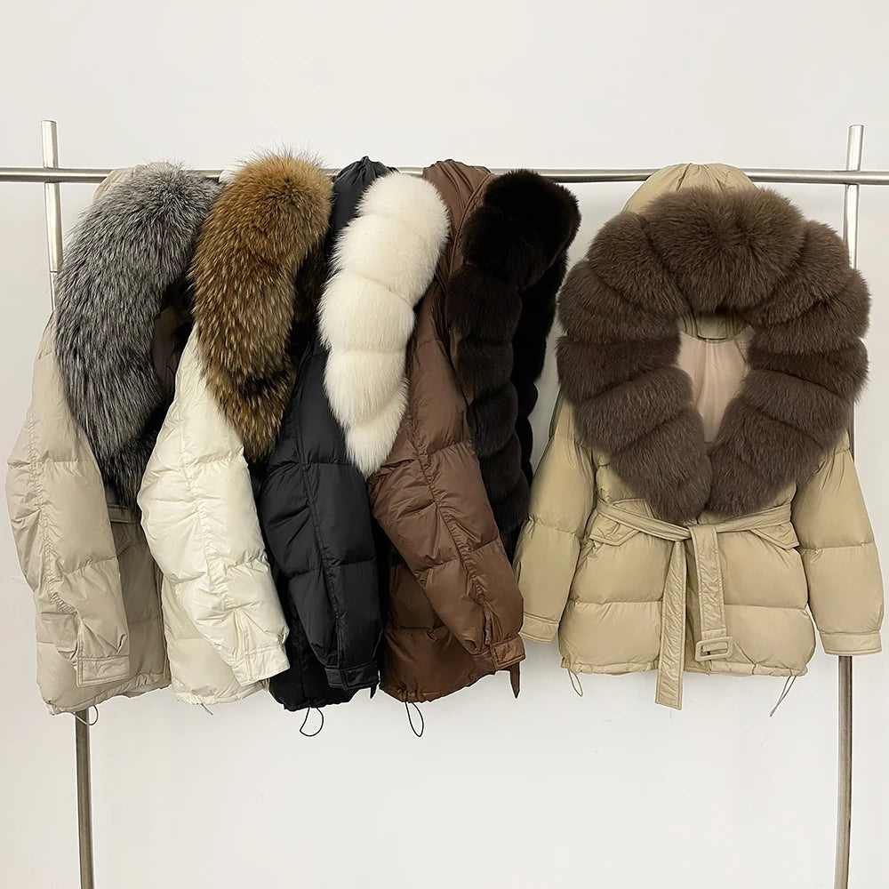 Collection of puffer jackets with fur collars on a rack 
