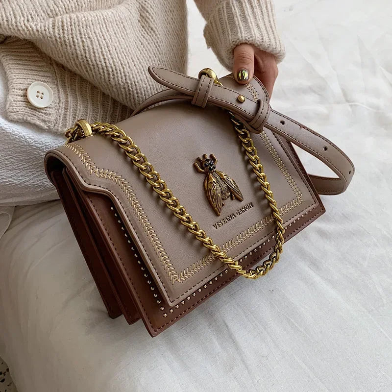 A stylish PU leather crossbody bag showcased against a neutral background, highlighting its elegant design and textured material.