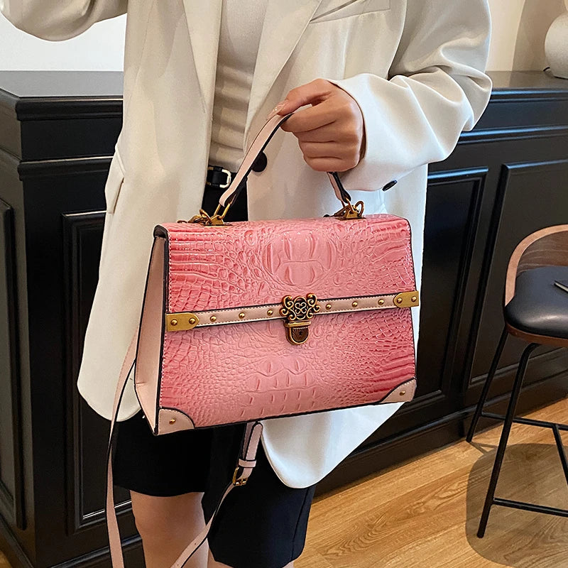 Structured pink crocodile embossed bag