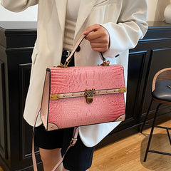Structured pink crocodile embossed bag
