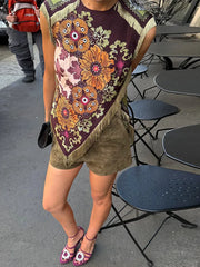 Close-up of boho patchwork sleeveless vest with fringe detail