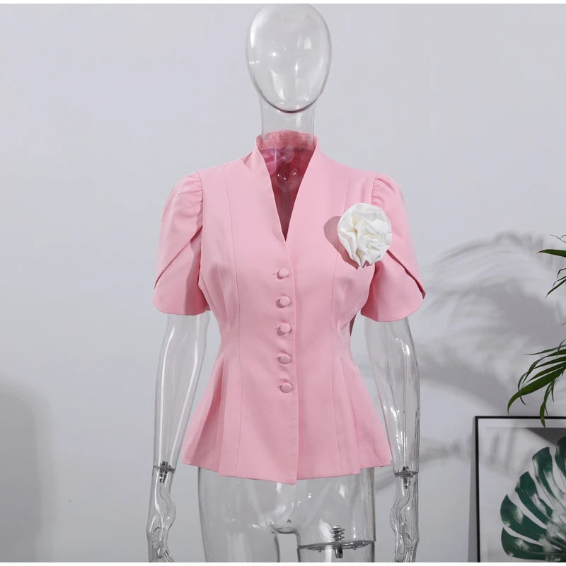 Pink blouse on a mannequin against a white background