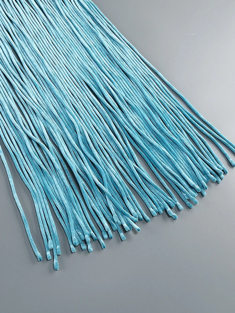 Turquoise shoelaces on a gray background