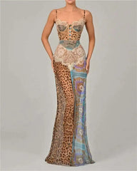 Long, patterned dress with a mix of leopard print and abstract designs on a plain background