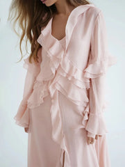 Pink ruffled dress on a white background