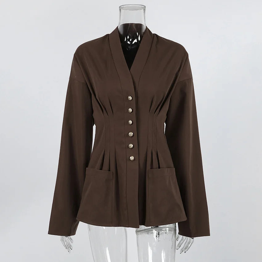 Brown jacket on a mannequin against a white background