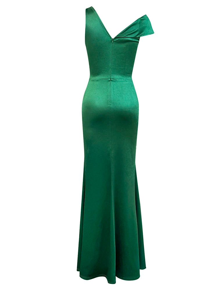 Green evening gown with a bow detail on a white background