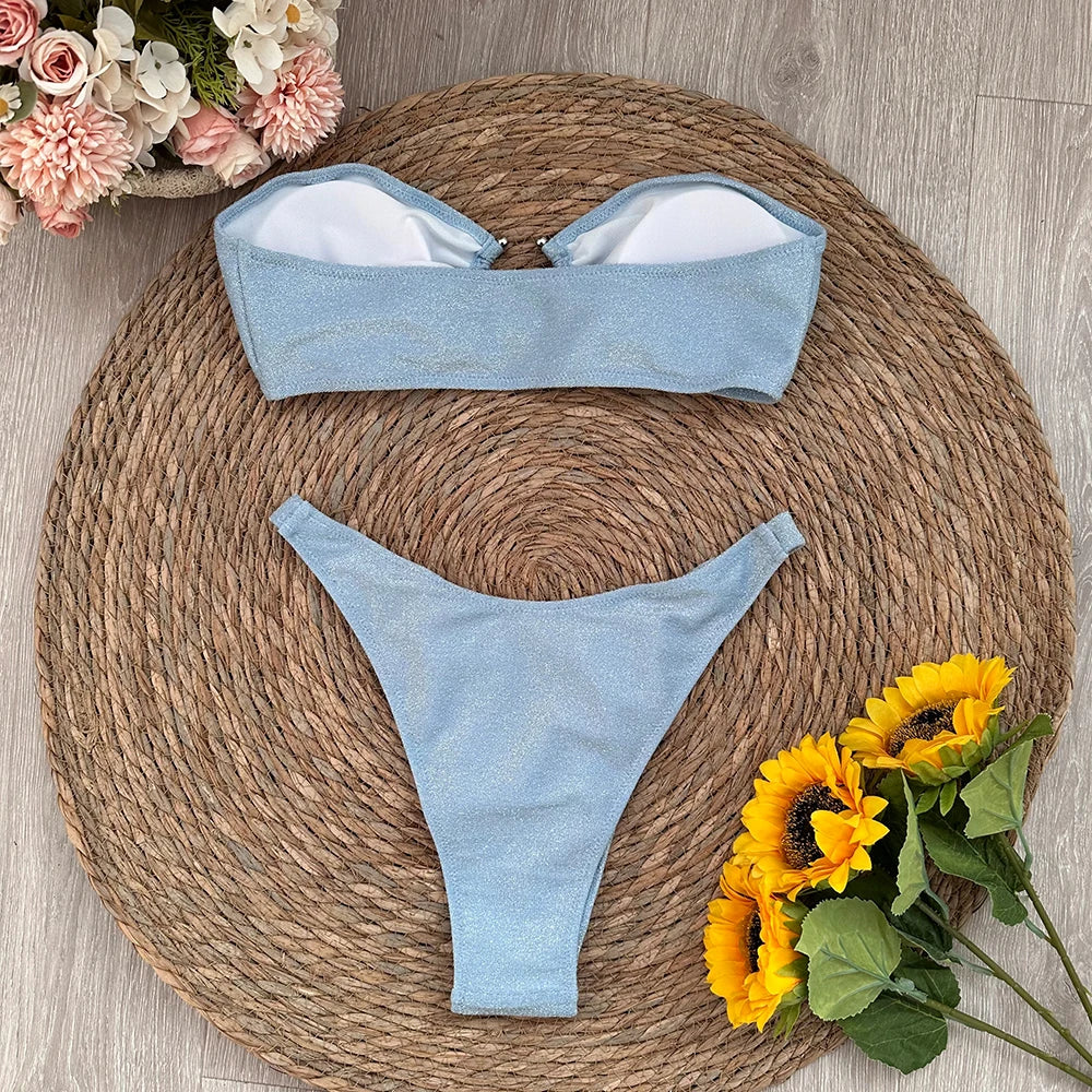 Sparkling bandeau bikini swimwear set laid flat with lining visible