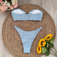 Sparkling bandeau bikini swimwear set laid flat with lining visible
