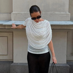 White polka dot mesh ruched top on model