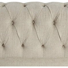 Beige upholstered headboard with tufted design