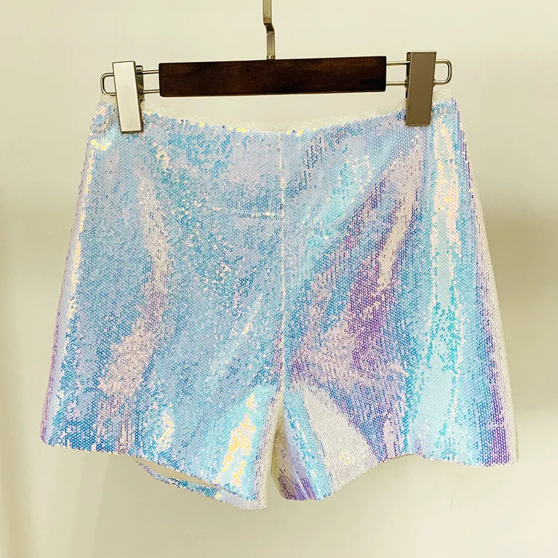Multicolored sequin shorts on a hanger against a plain background
