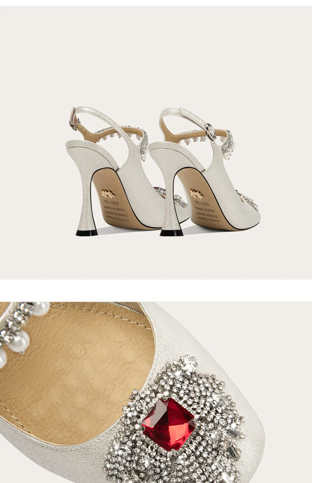 Silver high-heeled shoes with red gem and rhinestone embellishments on a white background.
