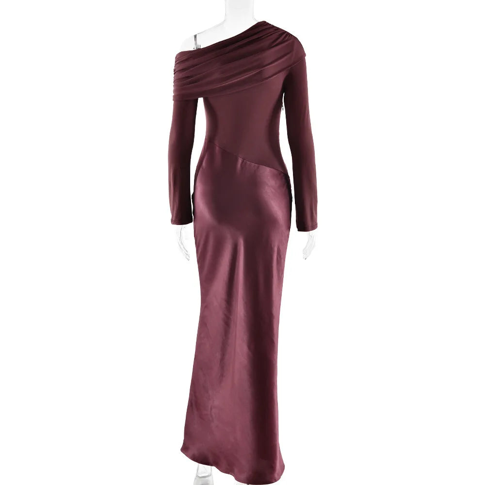 Maroon evening gown on a mannequin against a white background