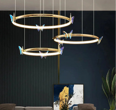 Modern chandelier with butterfly accents in a living room setting