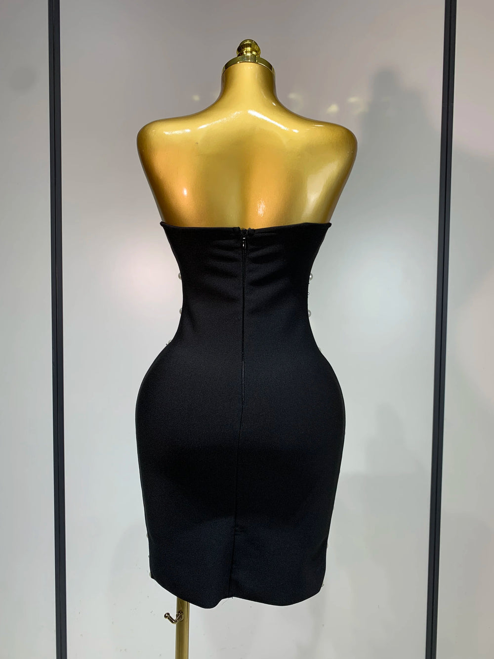 Back view of strapless pearl and rhinestone bodycon mini dress