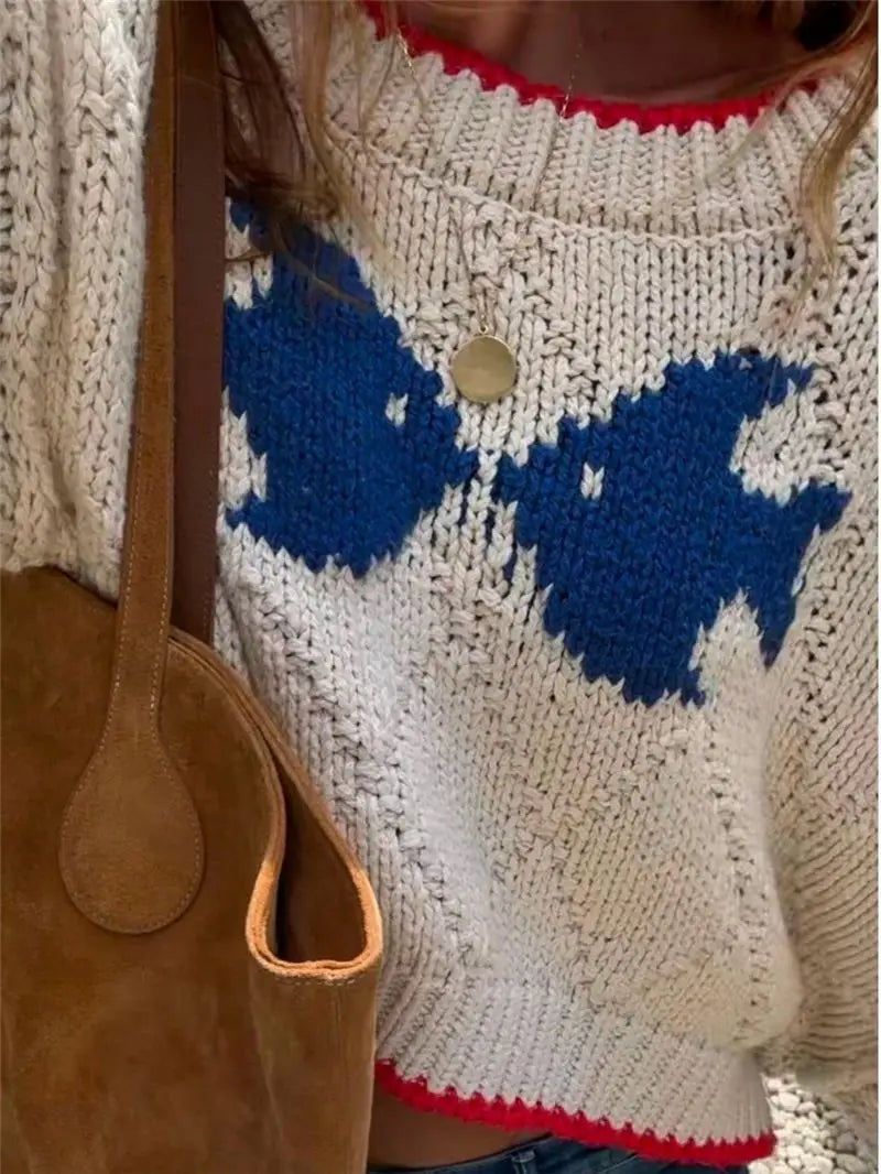 Close-up of cream contrast jacquard loose fit sweater