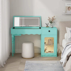 Turquoise vanity table with mirror in a bedroom setting