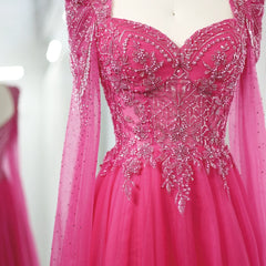   Close-up of the beadwork and elegant cape sleeves on the fuchsia Sharon Said gown. Golden Atelier 3