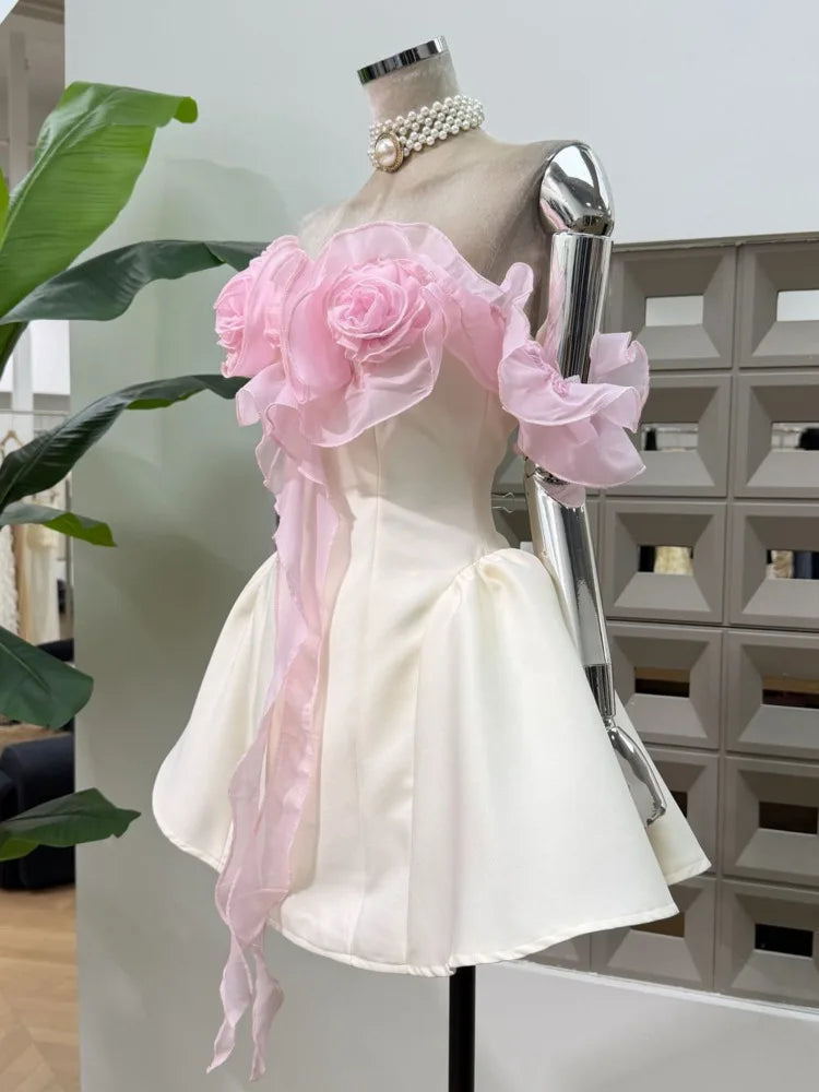 Side view of strapless mini dress with floral embellishments