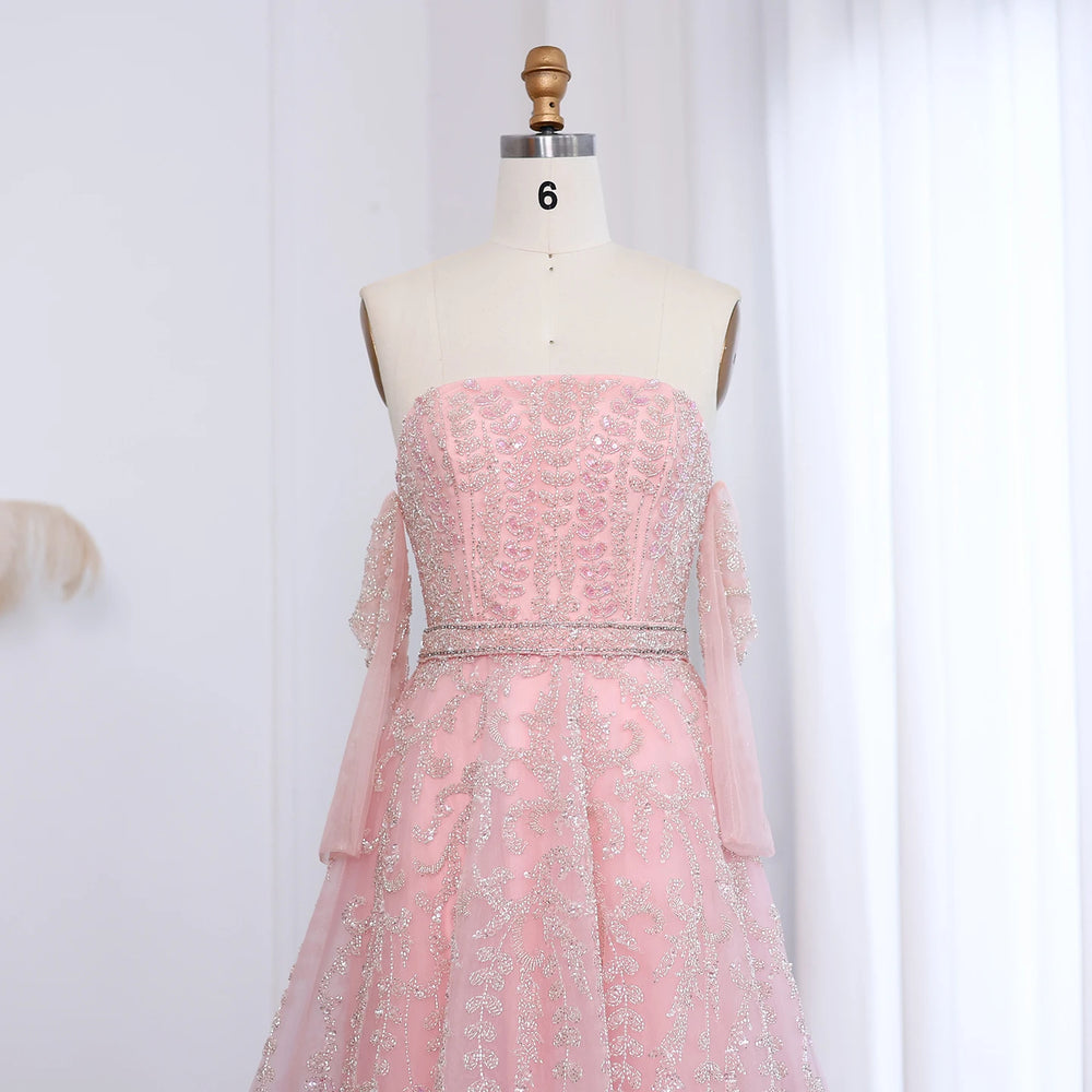 Pink strapless dress on a mannequin against a white background