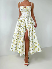 White floral dress with a high slit on a plain background