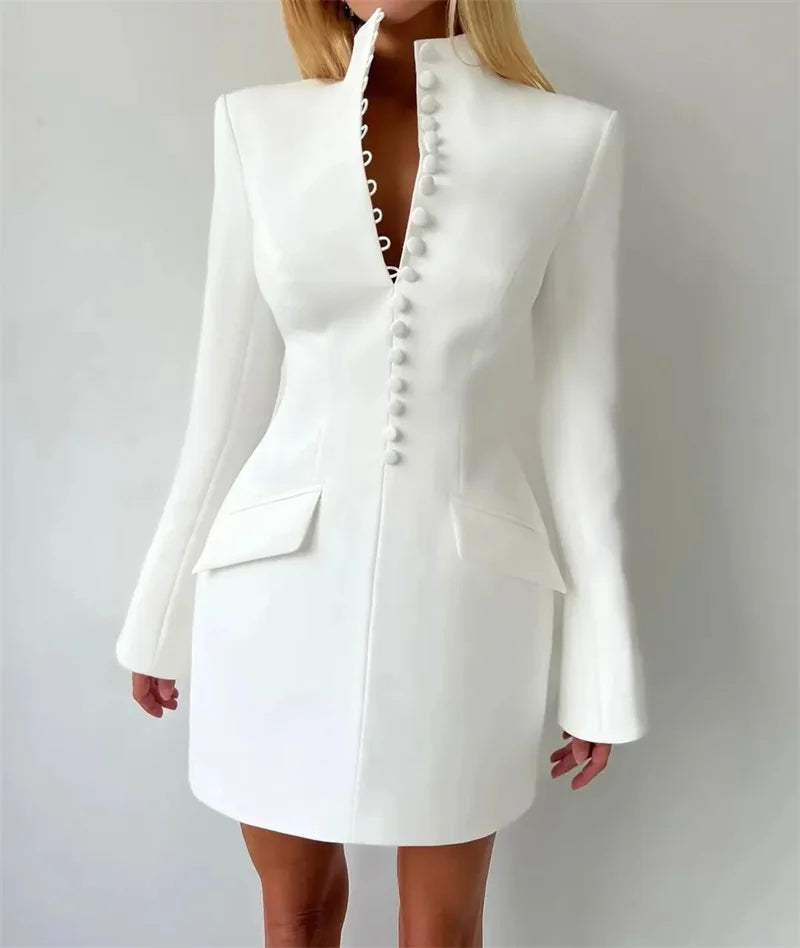 White blazer dress worn by a person on a plain background