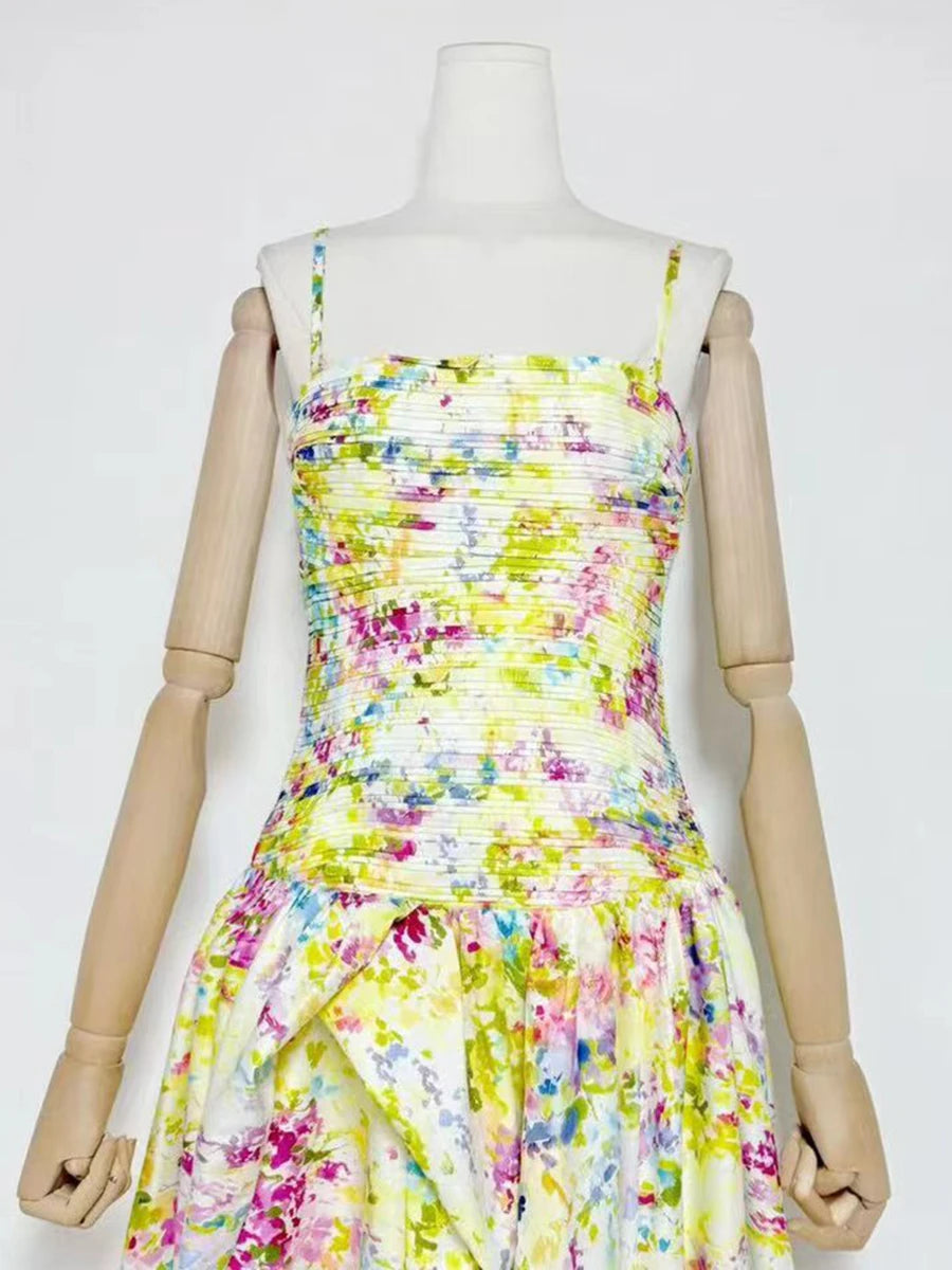 Colorful floral dress on a mannequin against a white background