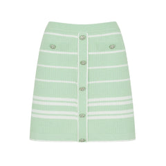 Green striped button-up knit skirt with white trim and embellished buttons.