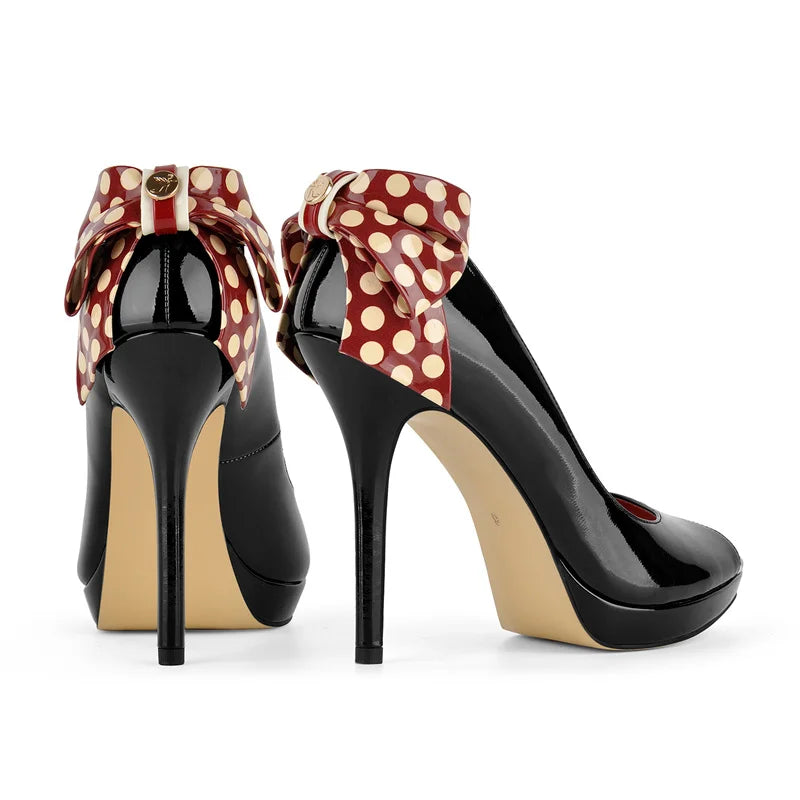 Pair of patent peep toe platform heels with polka dot bow detail
