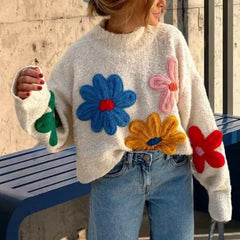 A model wearing a loose-fitting White crochet sweater with embroidered flowers and lantern sleeves. Golden Atelier 2