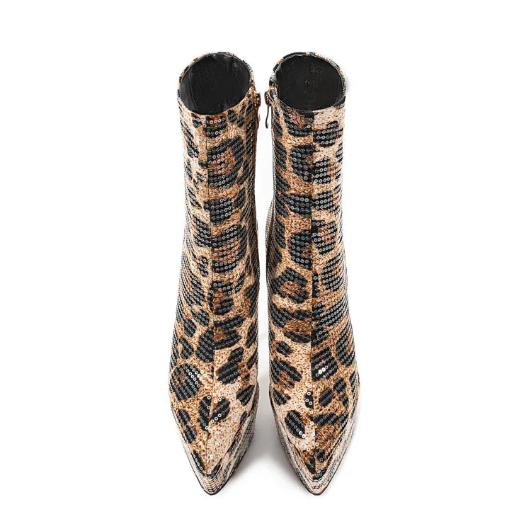 Pair of leopard print boots on a white background