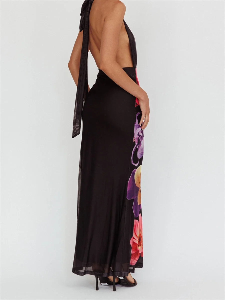 Black evening gown with floral details on a white background