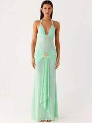 Mint green evening gown with a deep neckline on a white background