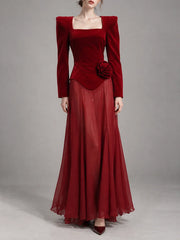 Red velvet maxi dress with a floral accent