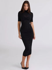 Black ruched turtleneck midi dress with a sculpted silhouette
