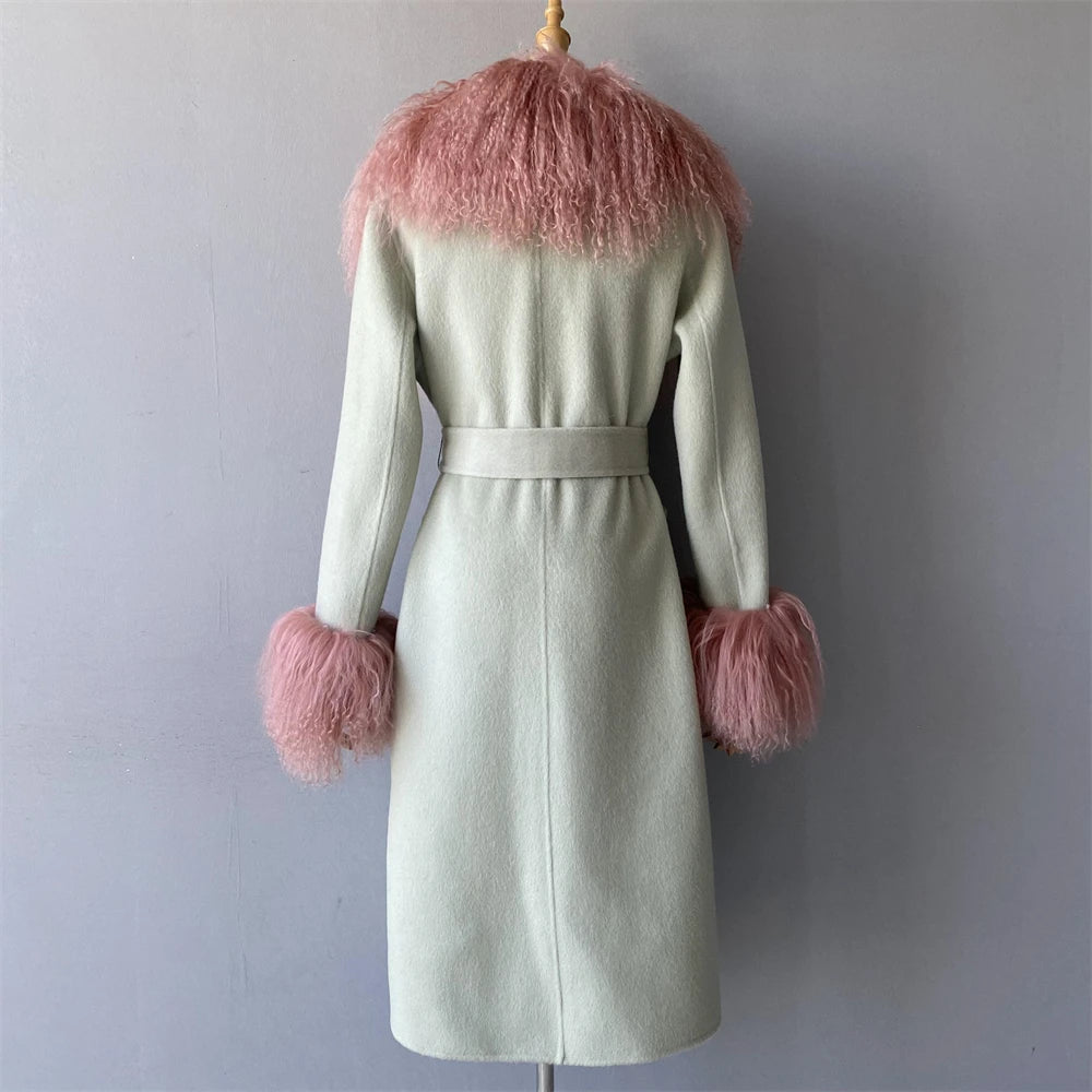 Light green coat with pink fur trim on a mannequin against a gray background
