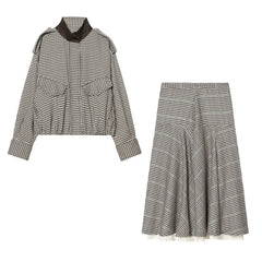 Black and white checkered outfit with jacket and skirt on a white background