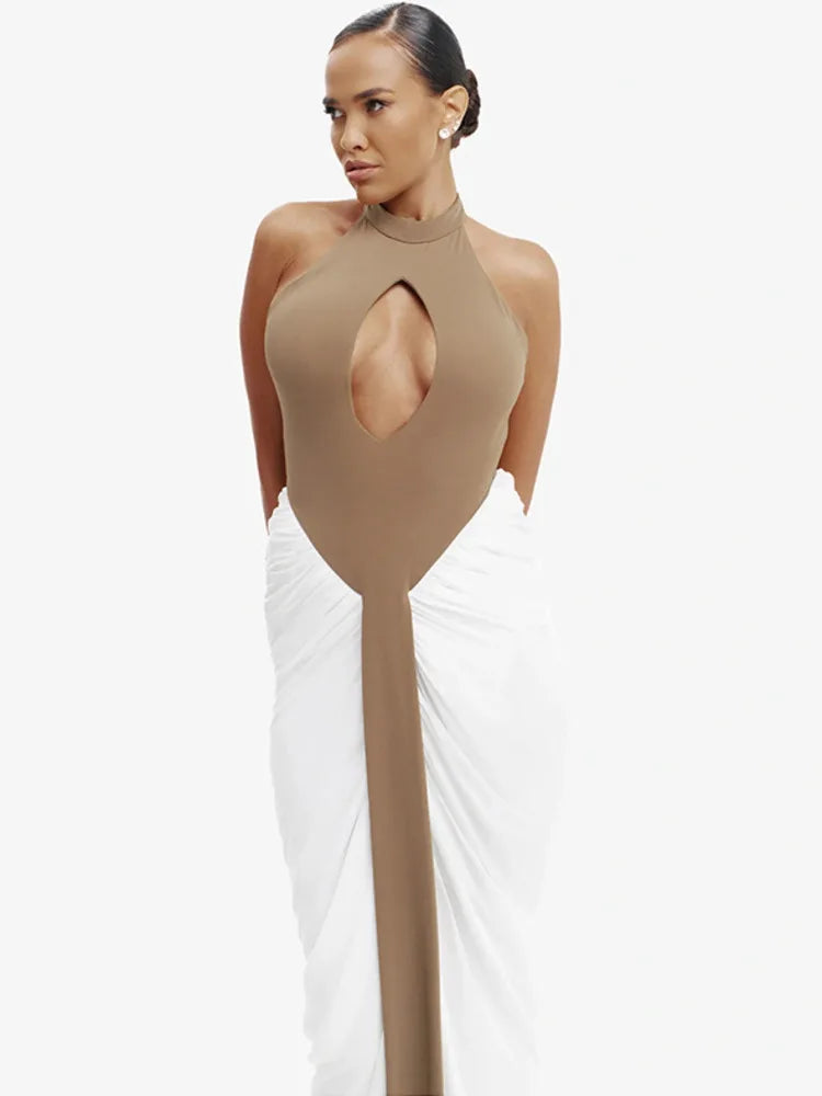 Woman wearing a two-tone dress with a brown top and white skirt on a white background