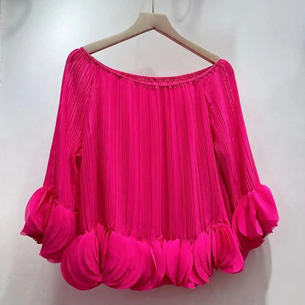 Hot pink pleated off-shoulder blouse on hanger