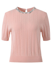 Pink sweater with a decorative collar on a white background