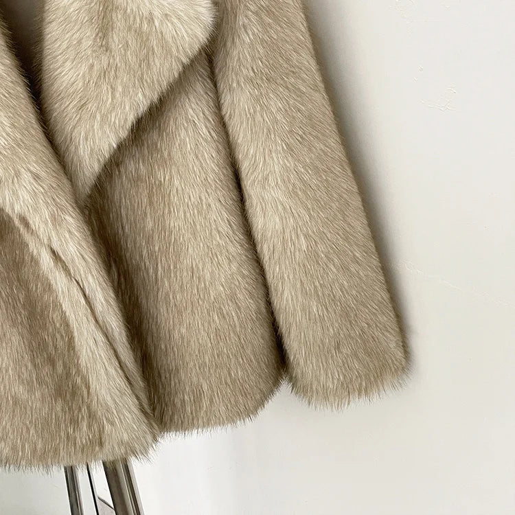 Close-up of beige faux fur fabric on a white background