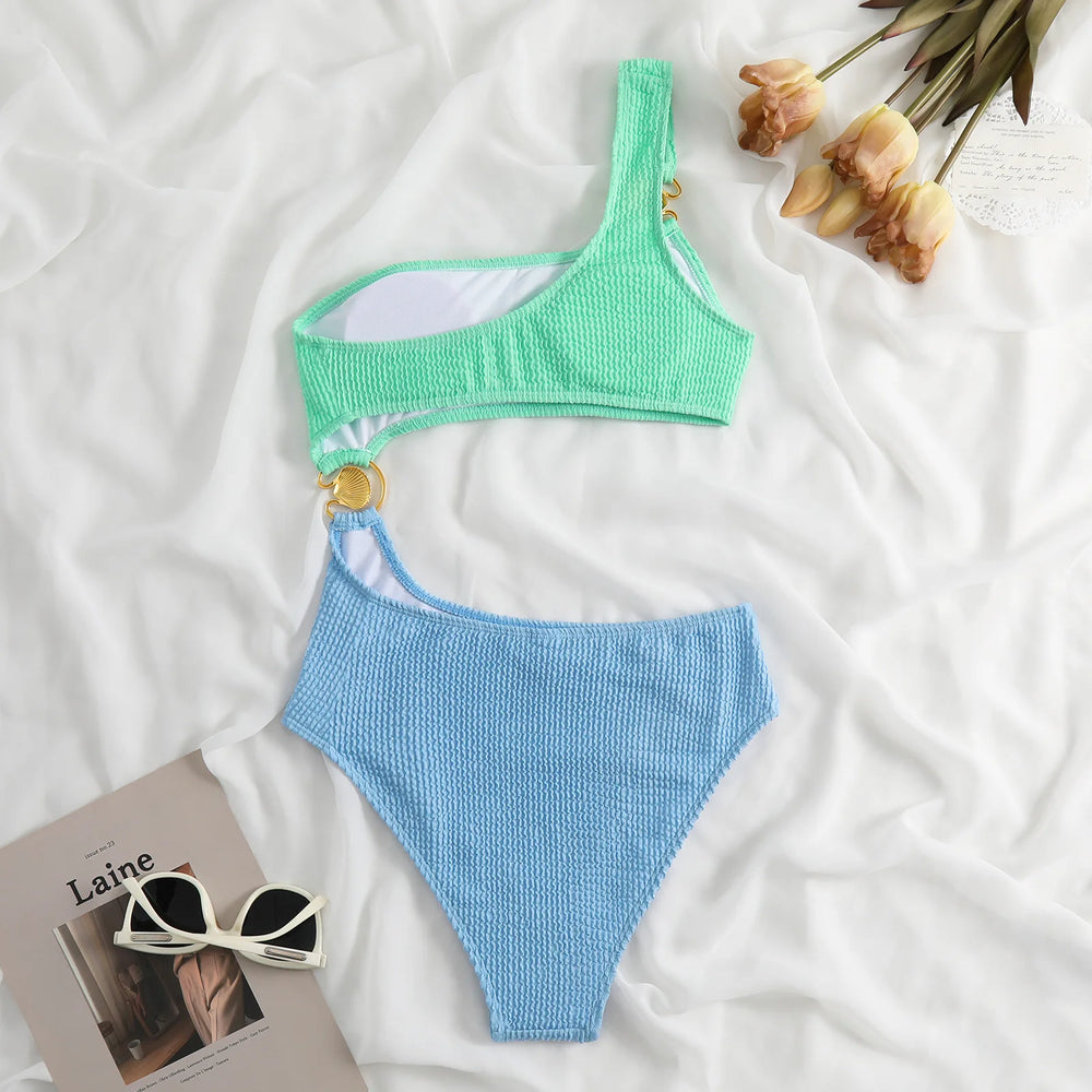 Ribbed one-piece swimsuit light green and blue laid flat