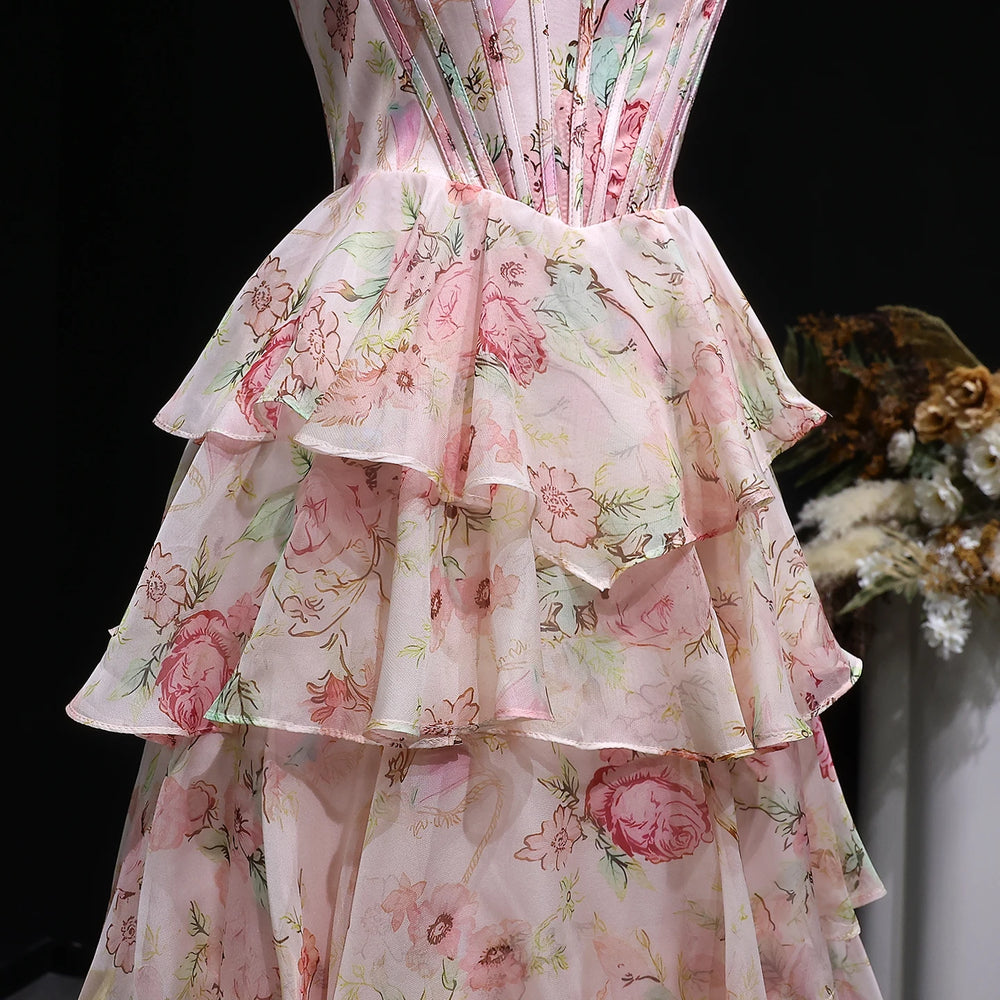 Floral dress with ruffled layers on a black background