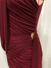 Maroon dress with gold embellishment on a white background