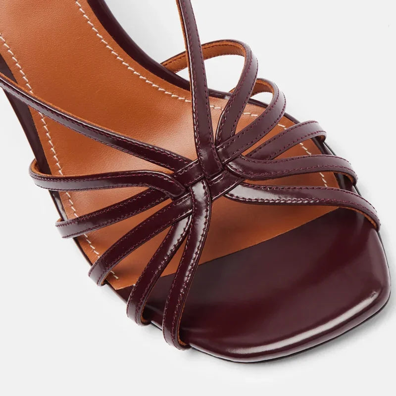 Close-up of strappy wedge heel sandals